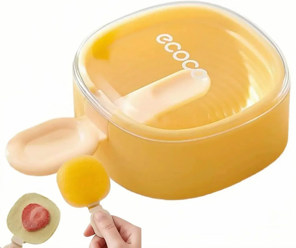Yellow silicone egg yolk separator with lid and egg yolk inside, held by hand with strawberry dough