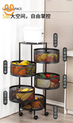 Five-tier black metal kitchen storage rack with mesh baskets holding fruits, vegetables, and a rice cooker on top