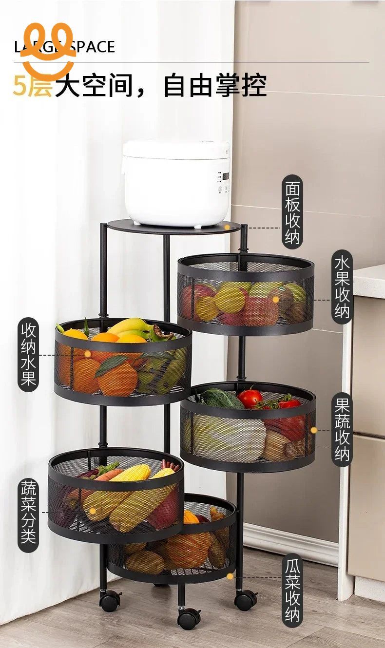Five-tier black metal kitchen storage rack with mesh baskets holding fruits, vegetables, and a rice cooker on top