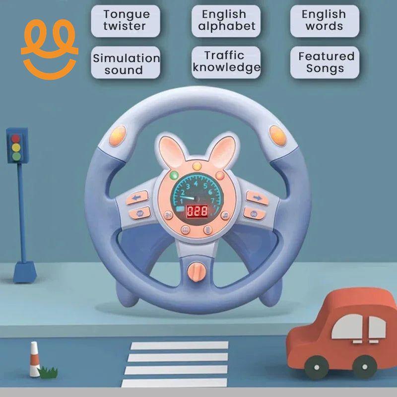 Blue toy steering wheel with bunny ears, speedometer, and buttons, near a toy traffic light and small red car