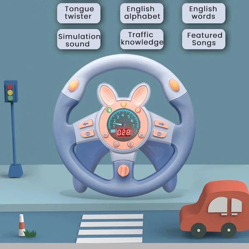 Blue toy steering wheel with bunny ears, speedometer, and buttons, near a toy traffic light and small red car