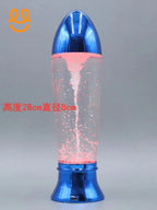 Blue metallic lava lamp with pink bubbles and digital display against gray background