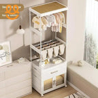 Modern white baby clothes storage rack with hanging rods, shelves, and cabinet in nursery room