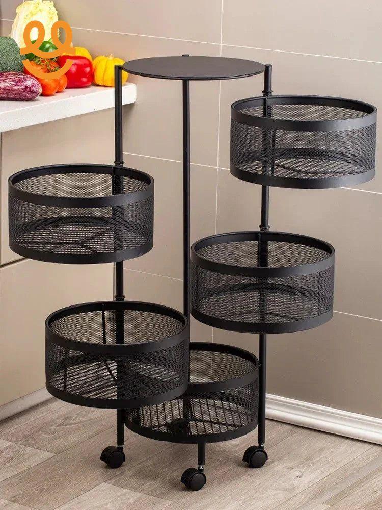 Black metal mesh kitchen organizer cart with five circular baskets and wheels on wood floor