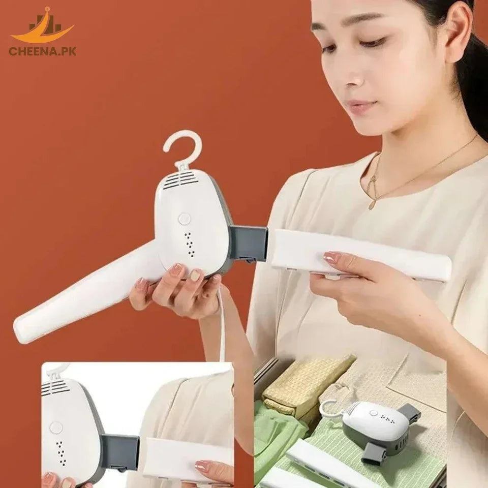 Woman assembling white handheld clothes steamer with detachable handle against orange background