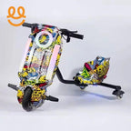 Electric drift trike with colorful graffiti design, LED lights, black handlebars, and three wheels