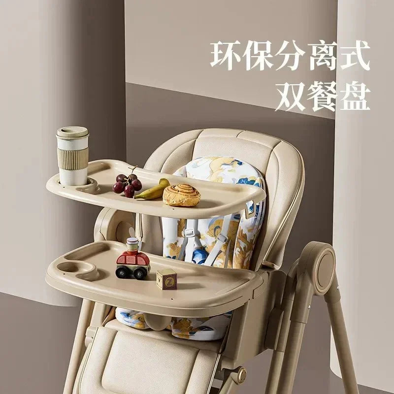 Beige baby high chair with dual trays holding snacks and toys, floral cushion, modern design