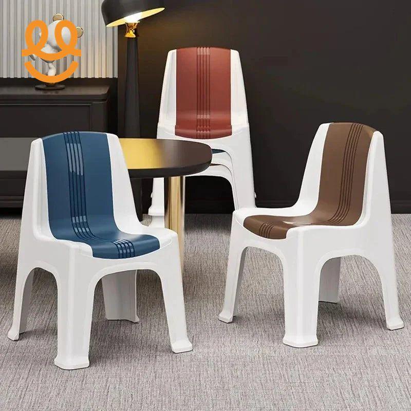 Three white plastic chairs with blue, brown, and red striped seats around a round table in a modern interior