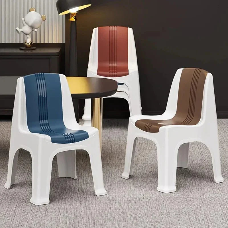 Three white plastic chairs with blue, brown, and red striped seats around a round table in a modern interior