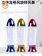 Three colorful desktop tornado liquid lamps with blue, orange, and pink bases on a marble surface