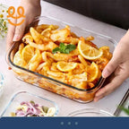 Hands holding glass container with spicy chicken feet garnished with lemon slices and mint