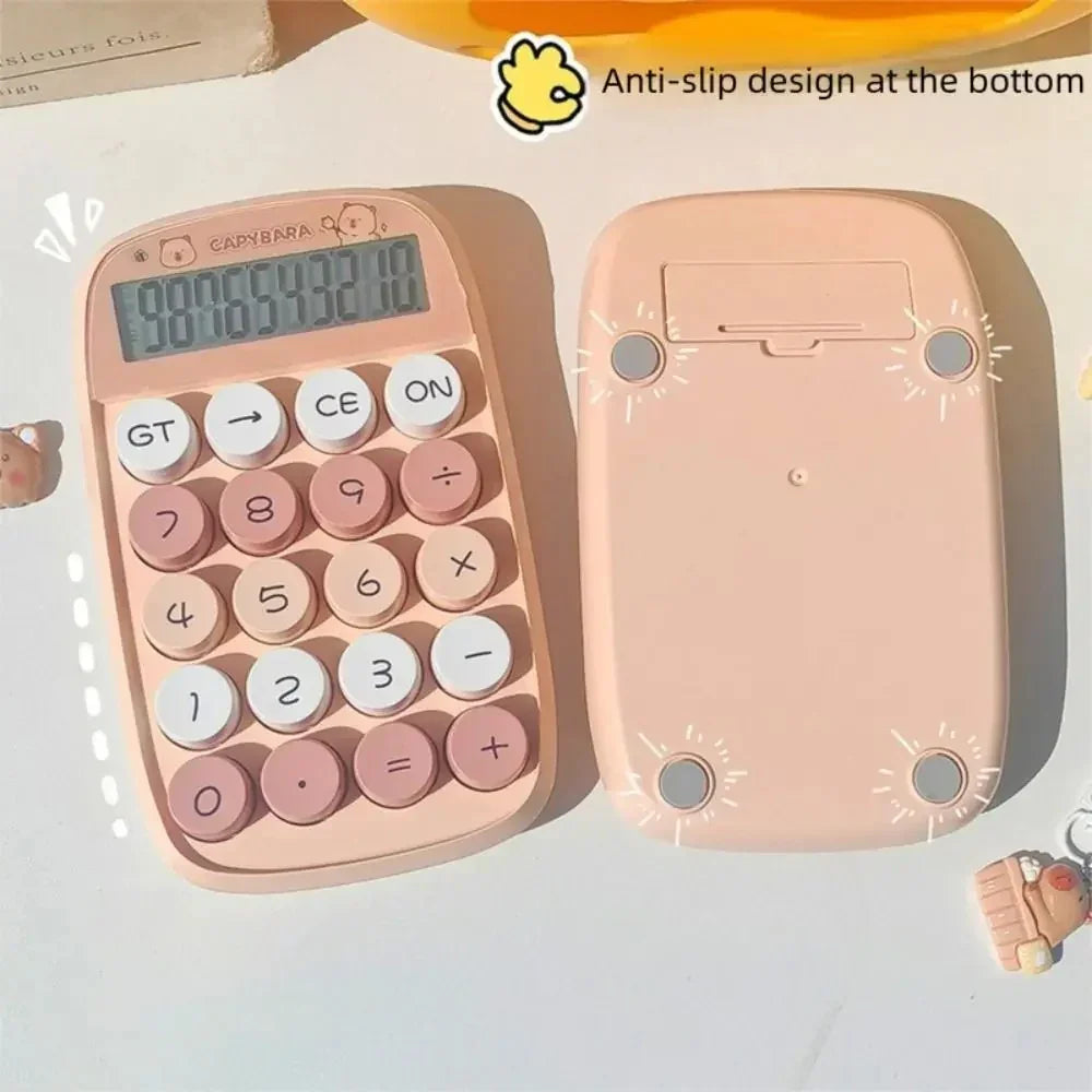 Pink capybara-themed calculator with round buttons and anti-slip design on white table