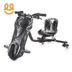 Black electric drift trike with white lightning bolt design and padded seat on white background