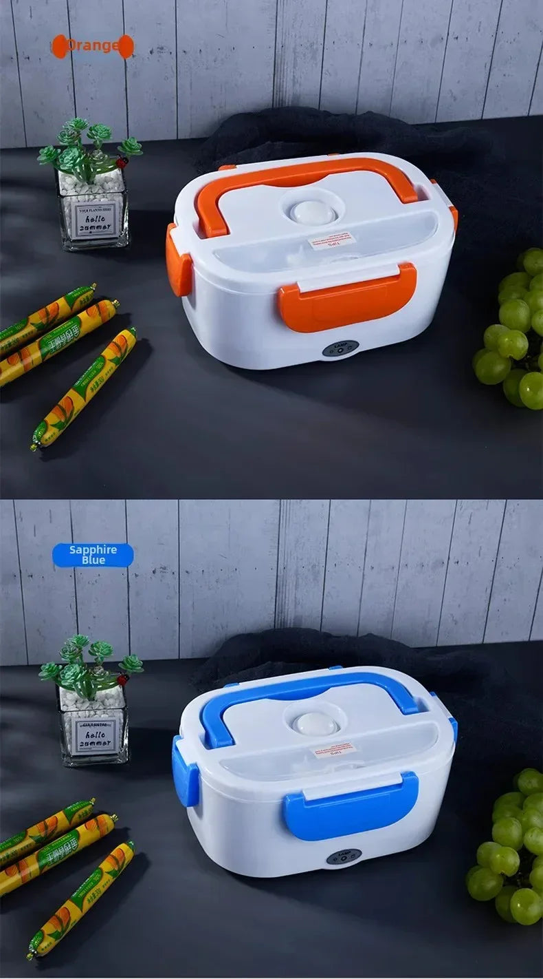 Two electric lunch boxes in orange and sapphire blue with food items and a small plant on dark surface