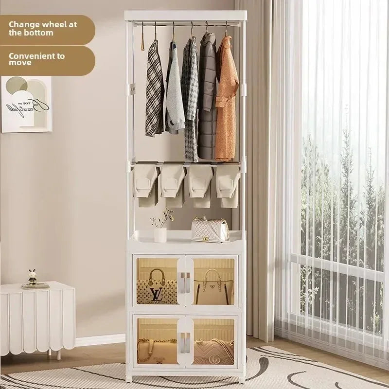 Modern white wardrobe rack with hanging clothes, storage bags, and display cabinets for handbags in bright room