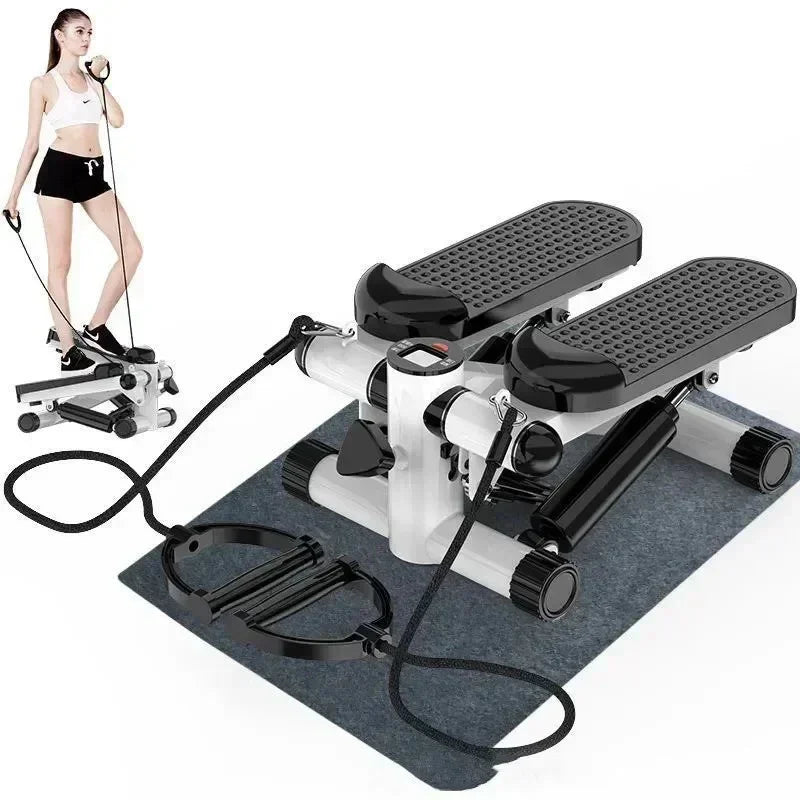 Compact mini stepper exercise machine with resistance bands and digital monitor on gym mat