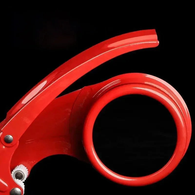 Close-up of red plastic jar opener with ergonomic handle and circular grip on black background