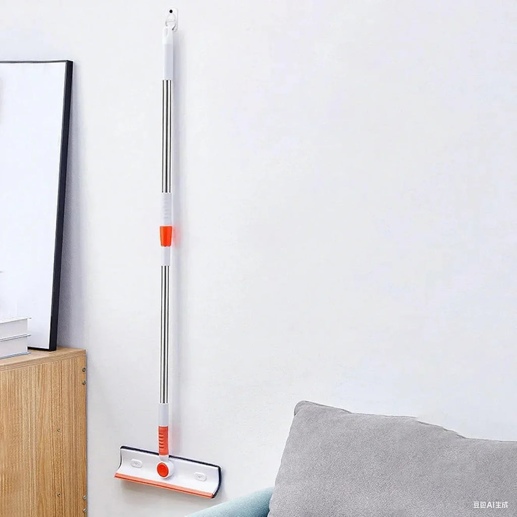 Wall-mounted mop with white and orange handle in a clean modern living room corner