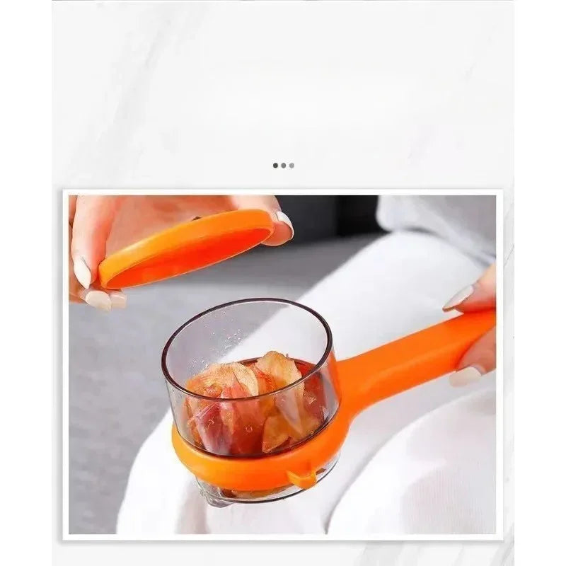 Hand using orange kitchen tool with transparent container to peel garlic cloves