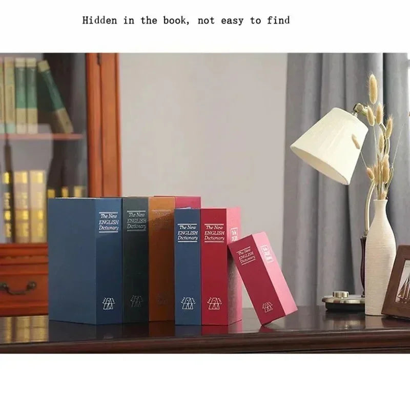 Desk with colorful dictionary books arranged as hidden boxes, next to a table lamp and vase