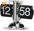 Retro flip clock with black and white numbers on a silver metallic base showing 12:58 AM