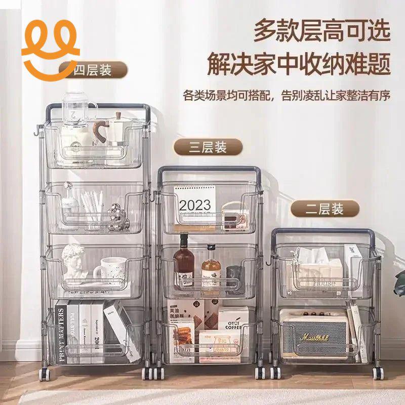 Three transparent multi-tier rolling storage carts with kitchen items and books against white wall