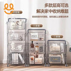 Three transparent multi-tier rolling storage carts with kitchen items and books against white wall
