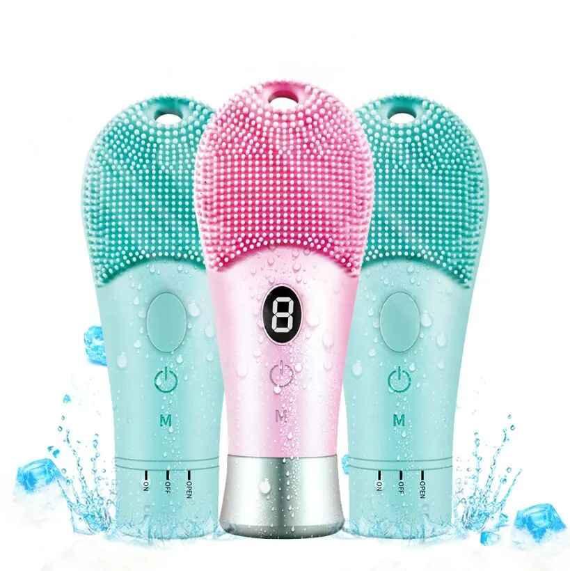 Three waterproof silicone facial cleansing brushes with water droplets and ice cubes, one pink and two teal
