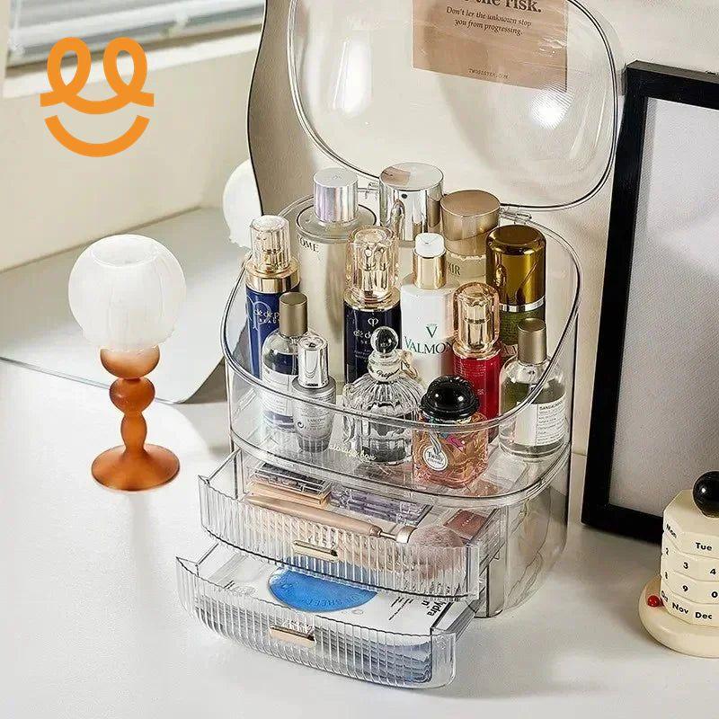 Transparent acrylic makeup organizer with skincare bottles and perfumes on white vanity table