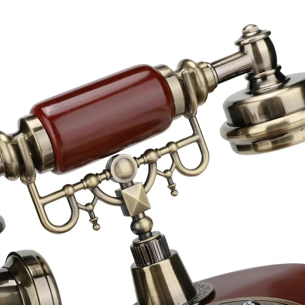 Close-up of vintage rotary telephone handset with brass and wooden accents on white background