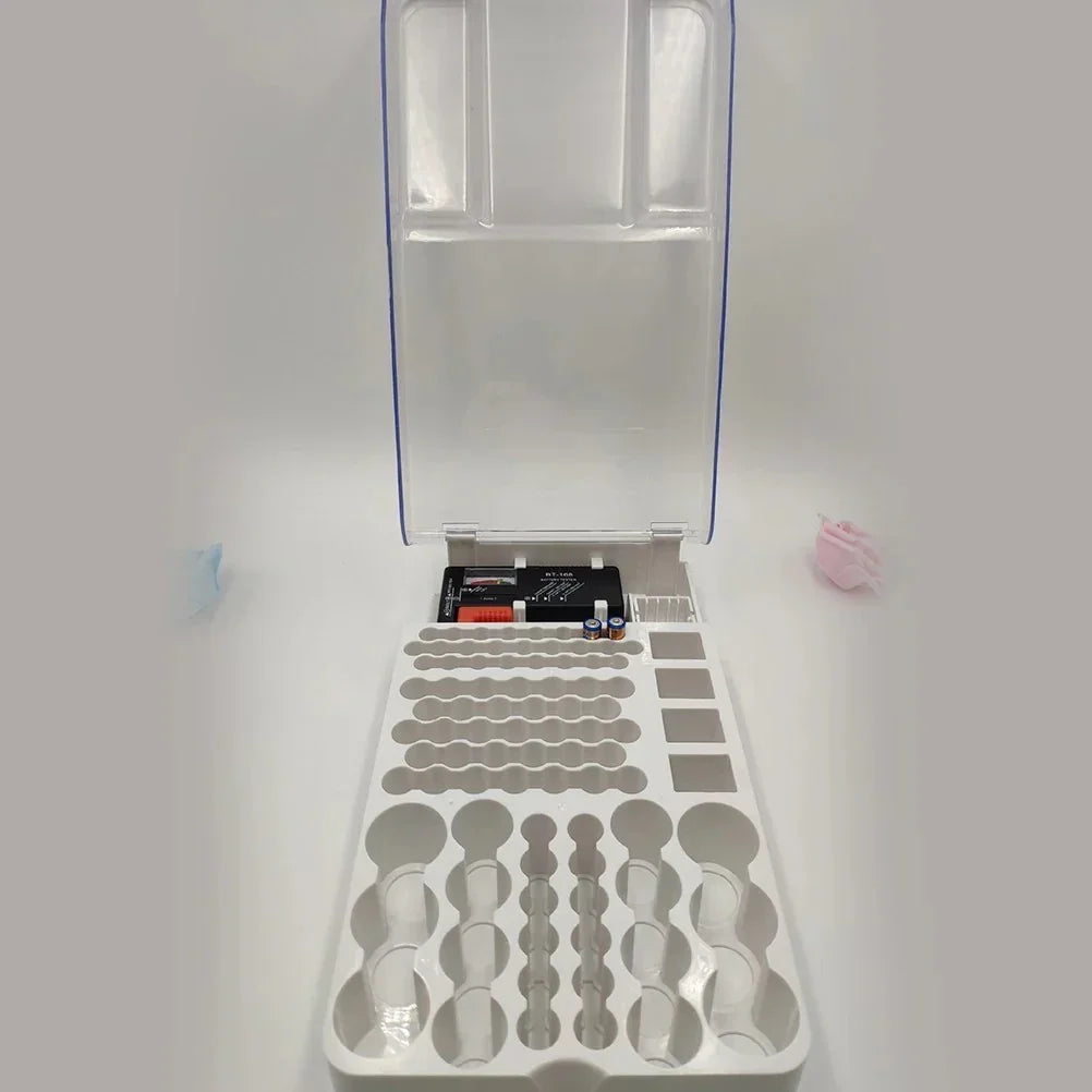 open white plastic storage case with battery tester, batteries, and various compartments on white background