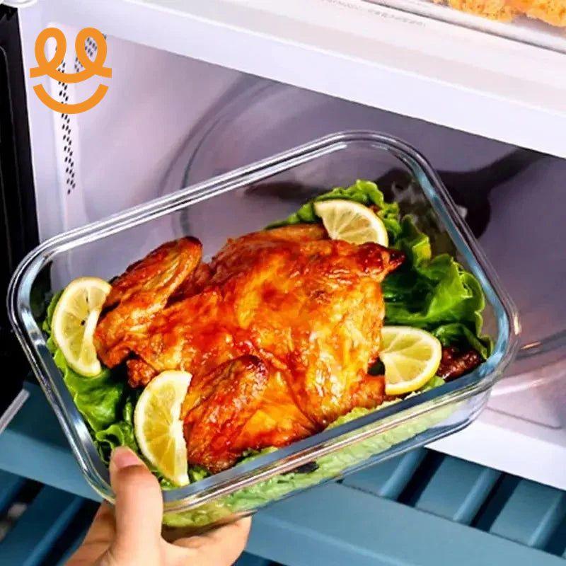 Hand placing a roasted whole chicken garnished with lemon slices and lettuce into a microwave oven
