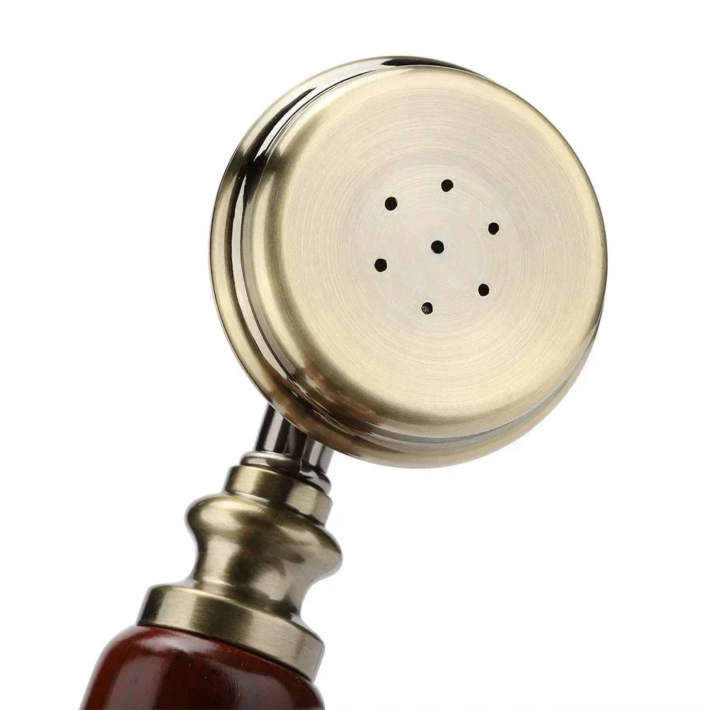 antique brass showerhead with round spray plate and wood handle