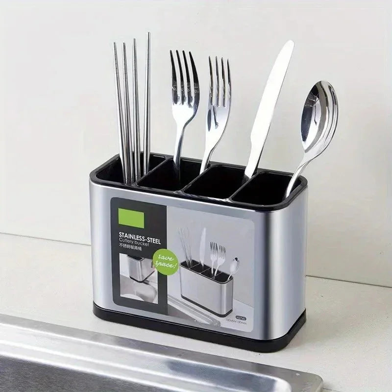 Stainless steel cutlery holder with compartments containing chopsticks, forks, knife, and spoon on kitchen counter