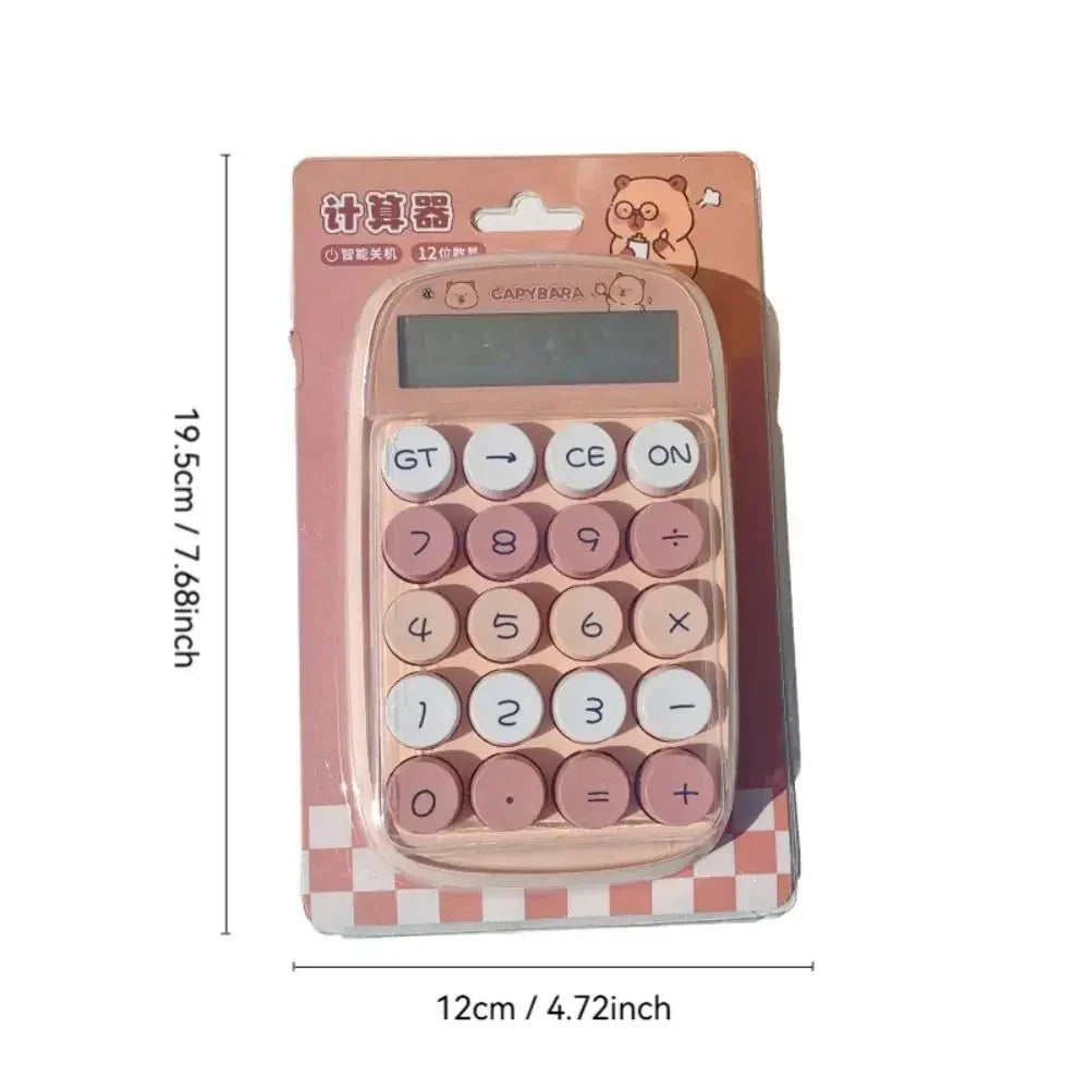 Pink and white capybara-themed calculator with round buttons in retail packaging