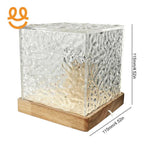 Modern textured glass cube lamp with wooden base and warm internal light