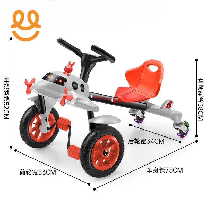 Red and gray kids ride-on tricycle with a red seat, black handlebar, and colorful wheels, dimensions labeled