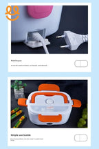 Electric lunch box with white body and orange handles, sealed with simple use buckle on black surface