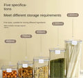 Five clear plastic storage containers with white clips in sizes 460ml, 700ml, 950ml, 1300ml, and 1800ml holding various dry foods