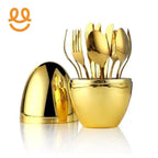gold-plated cutlery set including forks and spoons in a matching gold container with lid