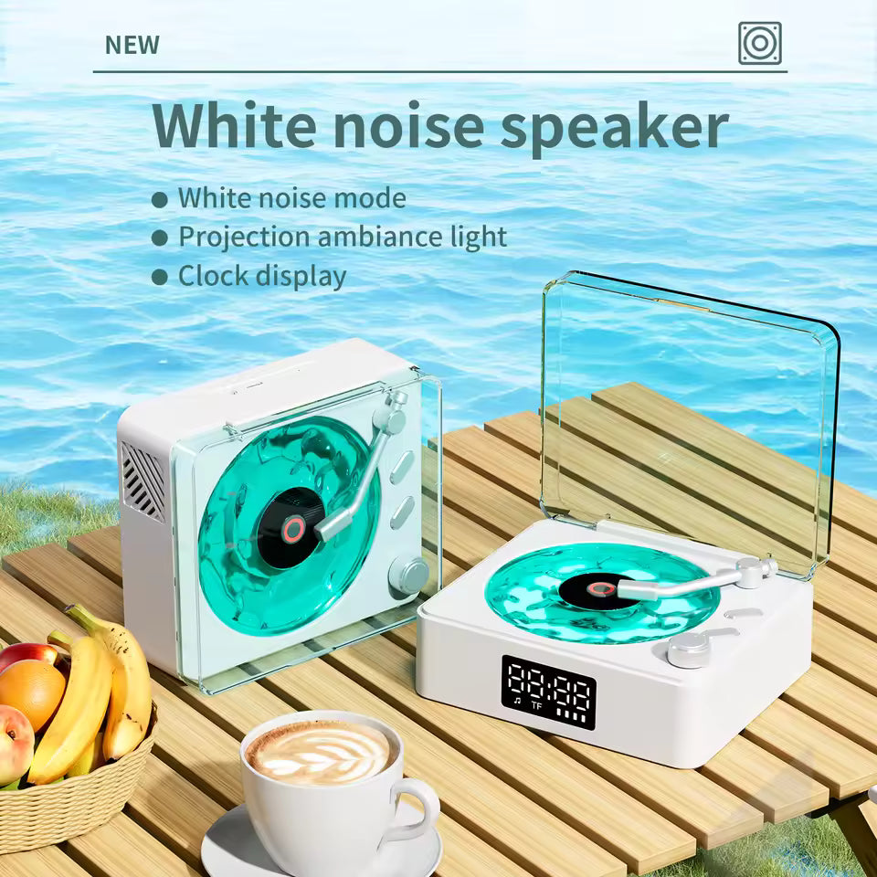 White noise speaker shaped like a vintage turntable with clock display on wooden table by water