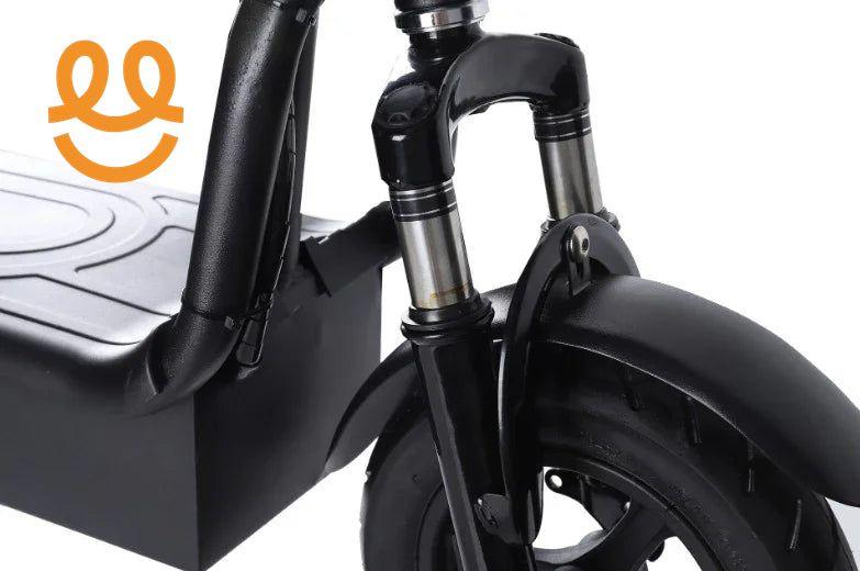 Close-up of black electric scooter front wheel with suspension fork and fender on white background