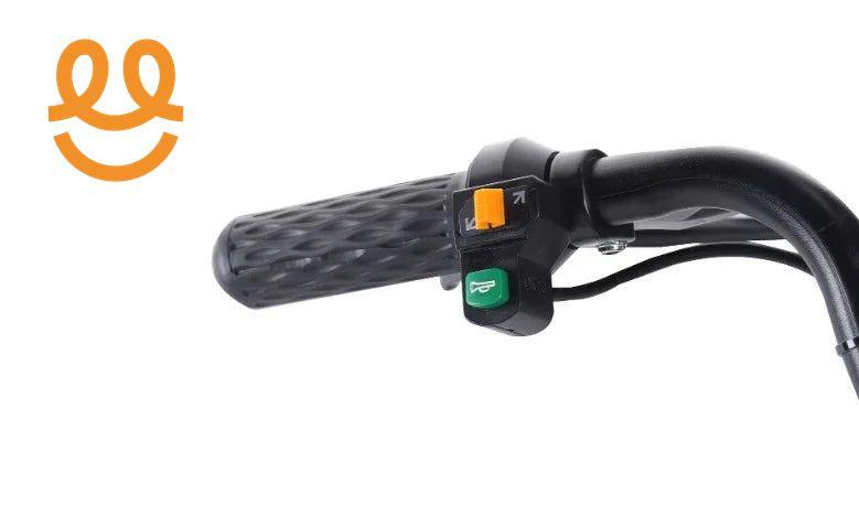 Close-up of black electric scooter handlebar with textured grip and green and orange control buttons