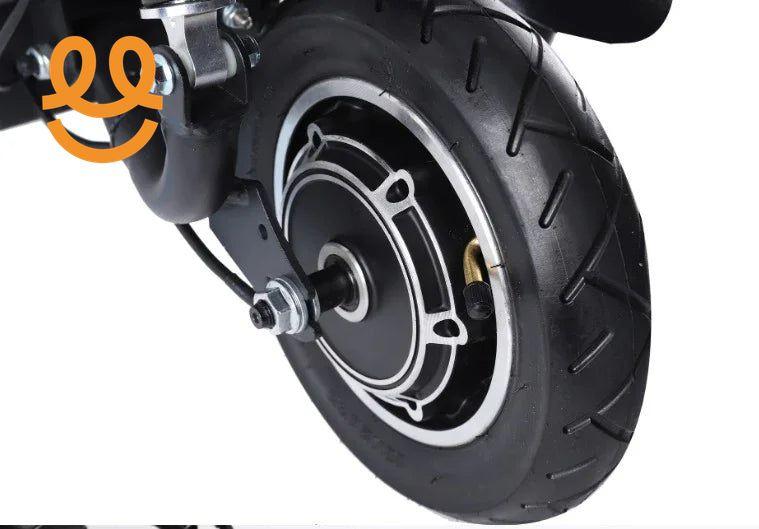 Close-up of black electric scooter motorized wheel with tire and metal components