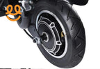 Close-up of black electric scooter motorized wheel with tire and metal components