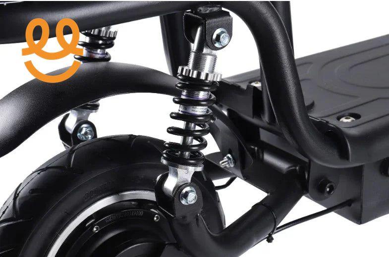 Close-up of black electric scooter rear wheel with suspension spring and sturdy frame