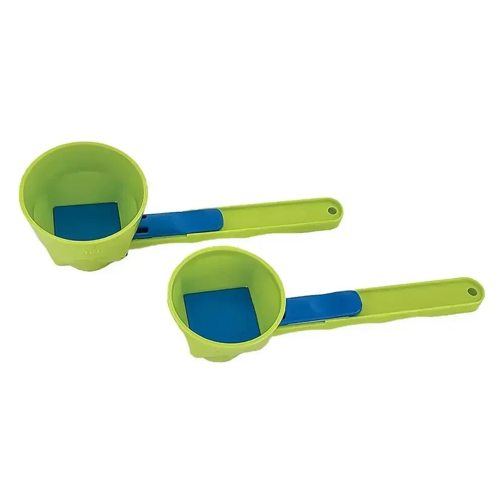 Set of two green and blue adjustable measuring scoops for kitchen use on white background