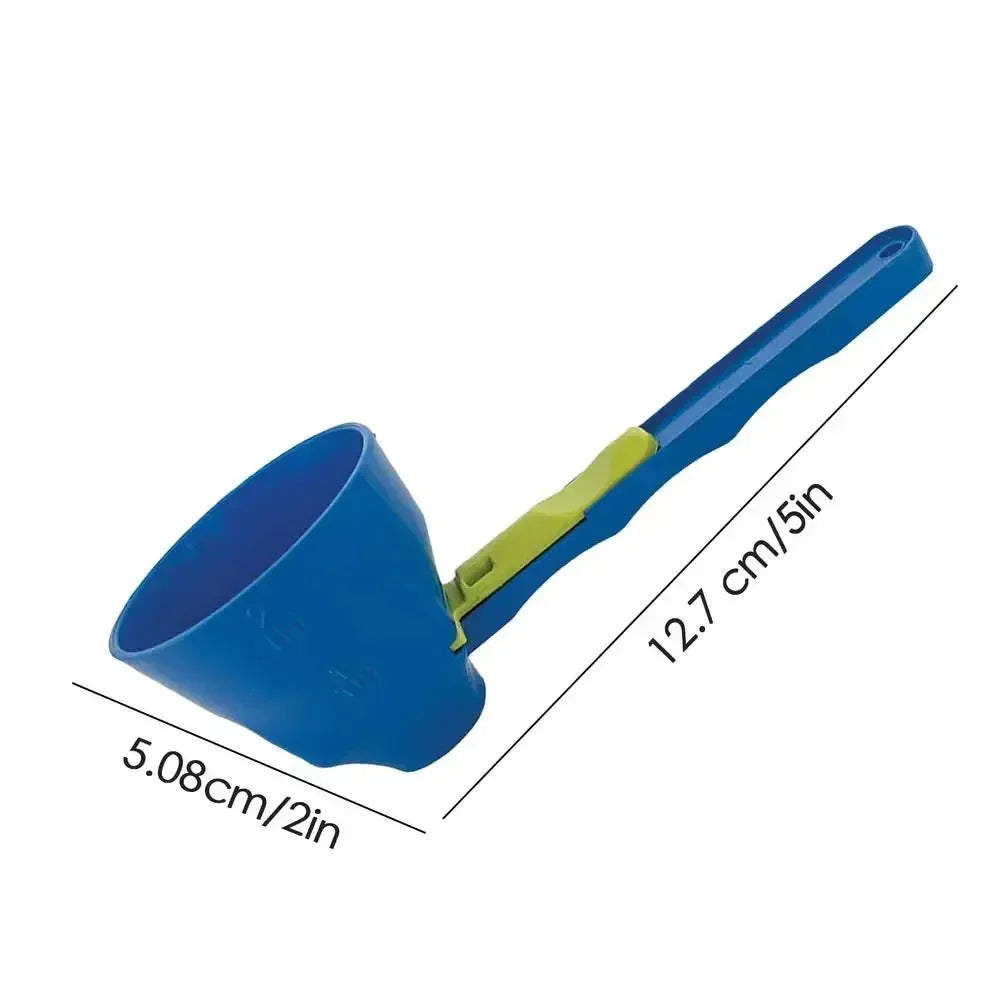 Blue plastic measuring scoop with a green clip, 12.7 cm long and 5.08 cm wide
