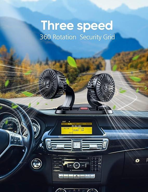 Black dual head car dashboard fan with three speed control and 360-degree rotation on a mountain road drive
