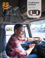 Man driving truck with installed dual black clip-on fans mounted on ceiling inside vehicle cabin